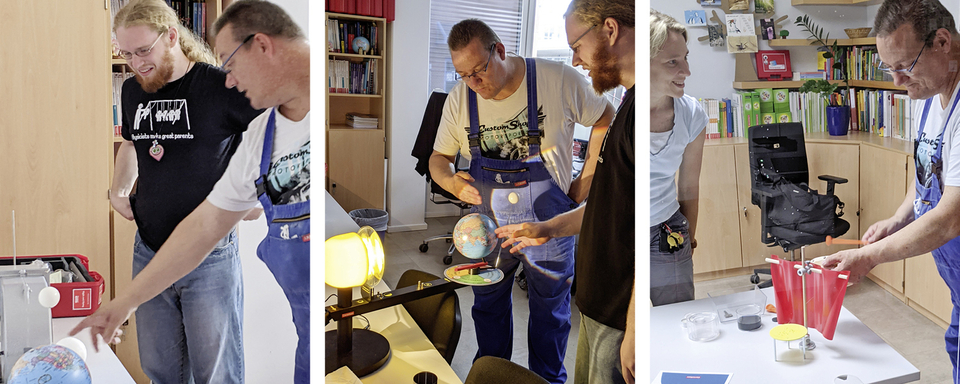 Das Bild zeigt eine Gruppe von Personen, die aktiv an Experimenten arbeiten. Sie verwenden verschiedene Materialien, um physikalische Konzepte zu demonstrieren, und scheinen dabei viel Spa&szlig; zu haben.