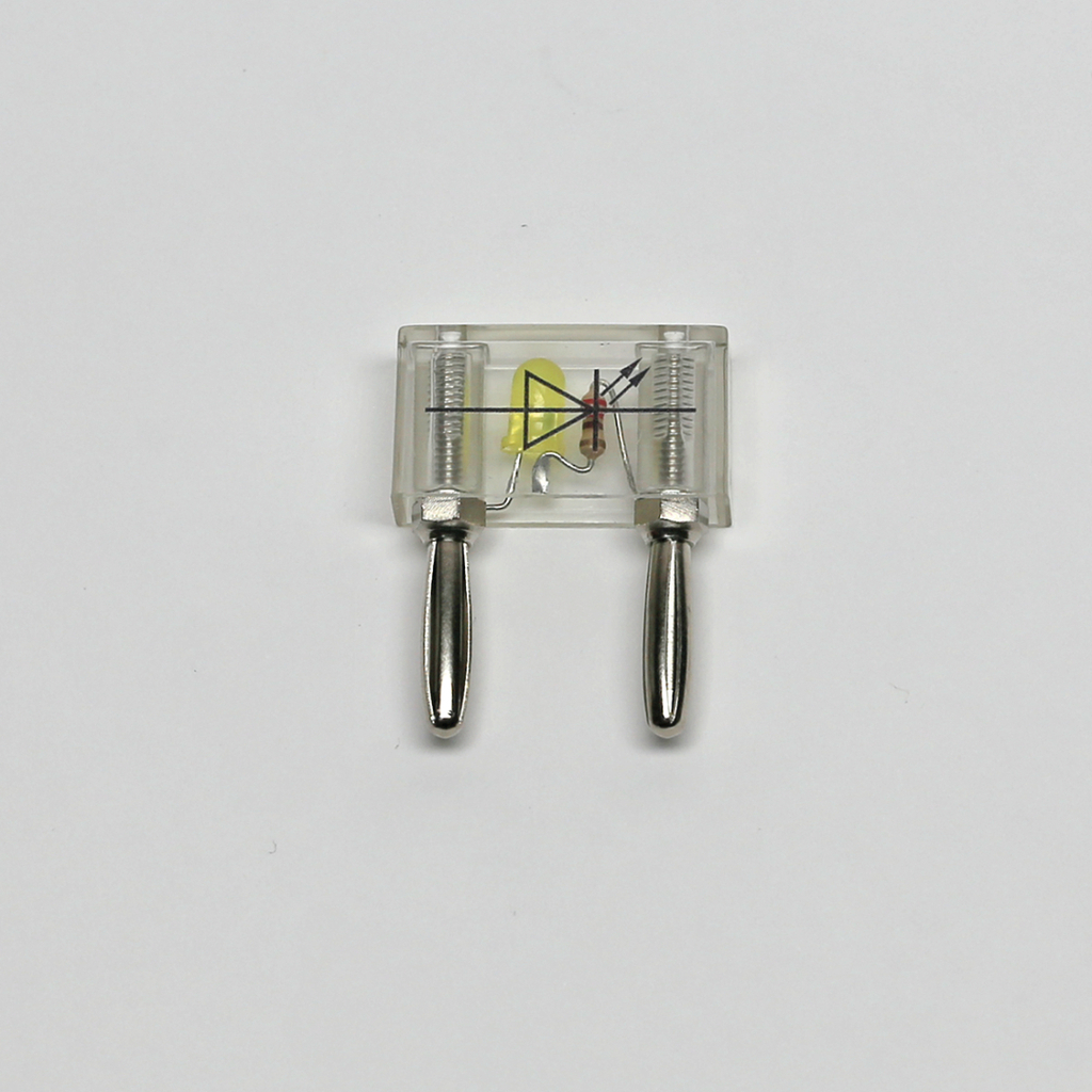 Das Bild zeigt einen durchsichtigen Schaltkreis mit zwei metallischen Verbindungselementen und einem gelben Bauteil, wahrscheinlich einer LED. Der Aufbau ist für Experimente in der Elektronik und im Bildungsbereich geeignet, um grundlegende elektrische Konzepte zu vermitteln.