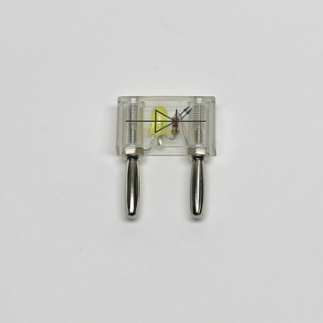 Das Bild zeigt einen durchsichtigen Schaltkreis mit zwei metallischen Verbindungselementen und einem gelben Bauteil, wahrscheinlich einer LED. Der Aufbau ist für Experimente in der Elektronik und im Bildungsbereich geeignet, um grundlegende elektrische Konzepte zu vermitteln.