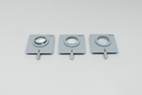 Drei optische Sammellinsen in grauen quadratischen Fassungen liegen nebeneinander. Die Linsen sind mit verschiedenen Brennweiten von 50 mm, 100 mm und 200 mm beschriftet.